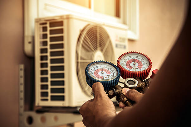Professional Air Conditioning Service technician working in East Sandwich, MA